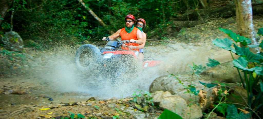 ATV splashing through a stream in Vallarta, Mexico.